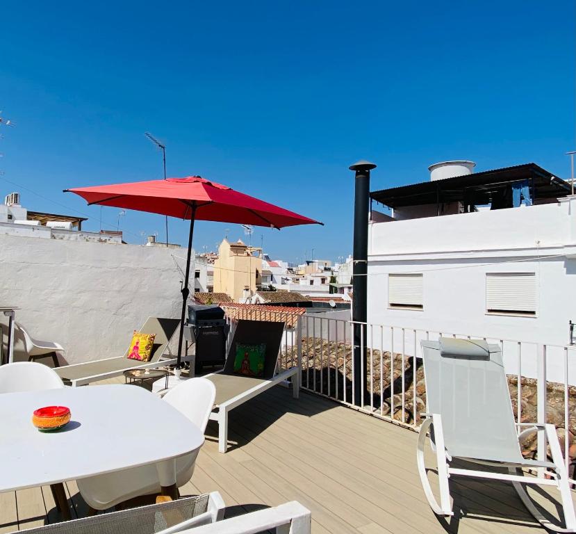 Rooftop solarium above the tiled roofs of Estepona